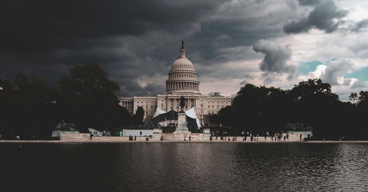 The US Capitol Building against a backdrop of stormy skies in Washington DC.